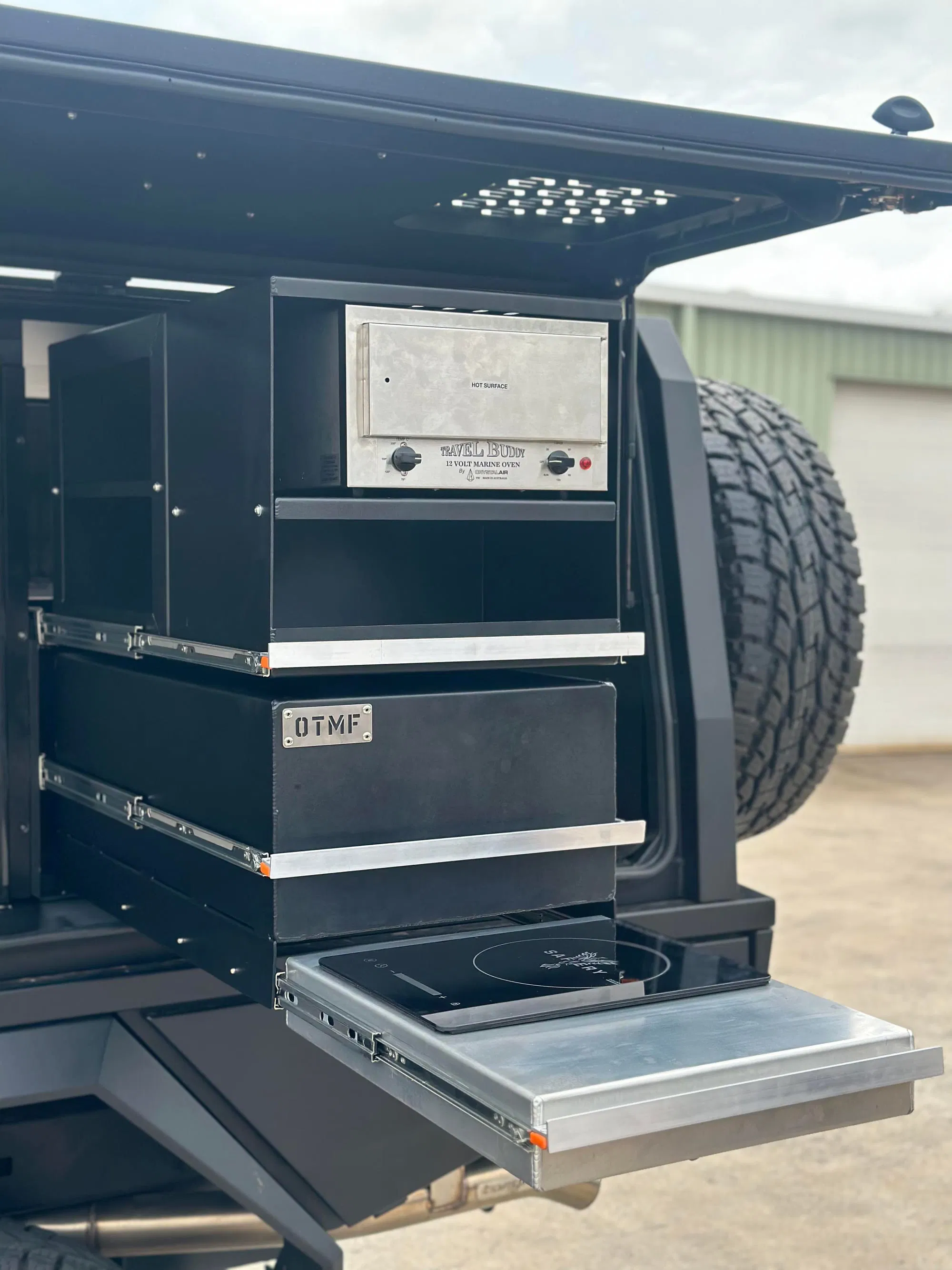 Custom drawer system with travel buddy oven